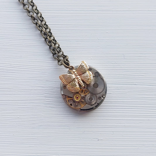 NEW!! Mini timepiece pendant with golden butterfly